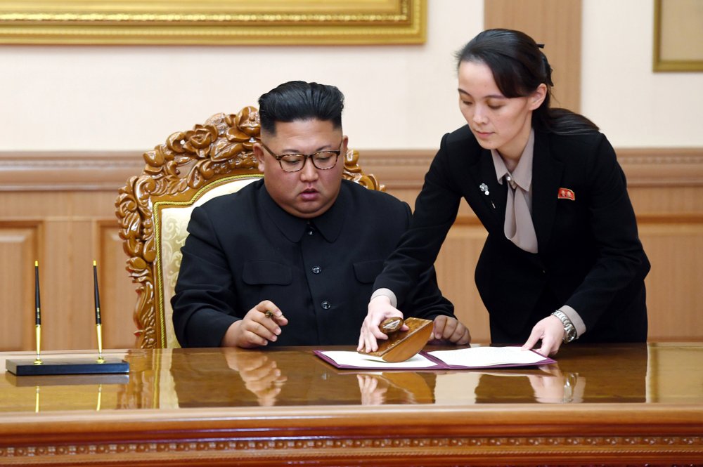 FILE - In this Sept. 19, 2018, file photo, Kim Yo Jong, right, helps her brother North Korean leader Kim Jong Un sign a joint statement following the summit with South Korean President Moon Jae-in at the Paekhwawon State Guesthouse in Pyongyang, North Korea. North Korea has threatened to end an inter-Korean military agreement reached in 2018 to reduce tensions if the South fails to prevent activists from flying anti-Pyongyang leaflets over the border. The powerful sister of Kim Yo Jong also said Thursday, June 4, 20202, the North could permanently shut a liaison office with the South and an inter-Korean factory park in the border town of Kaesong, which have been major symbols of reconciliation between the rivals. (Pyongyang Press Corps Pool via AP, File)