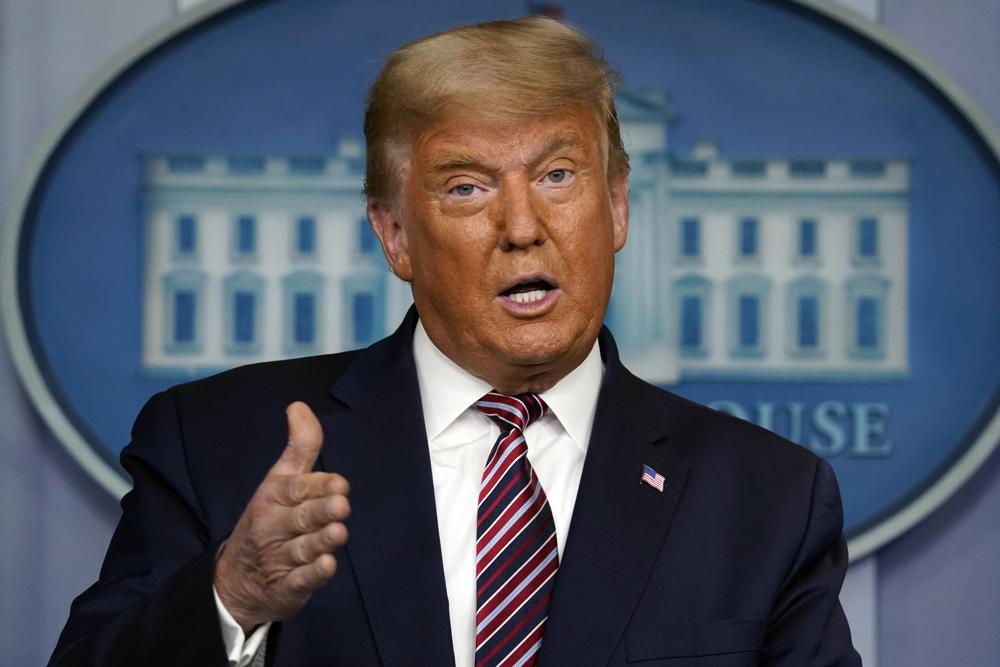 FILE -  President Donald Trump speaks at the White House in Washington, on Nov. 5, 2020. Questions about Trump’s business practices are piling up. Whether the former president is forced to answer any of them could be decided in a matter of days. New York’s attorney general will go to court Thursday, Feb. 17, 2022, seeking to enforce a subpoena for Trump’s testimony in a civil investigation she says uncovered evidence his company used “fraudulent or misleading” valuations of his properties to get loans and tax benefits.  (AP Photo/Evan Vucci, File)