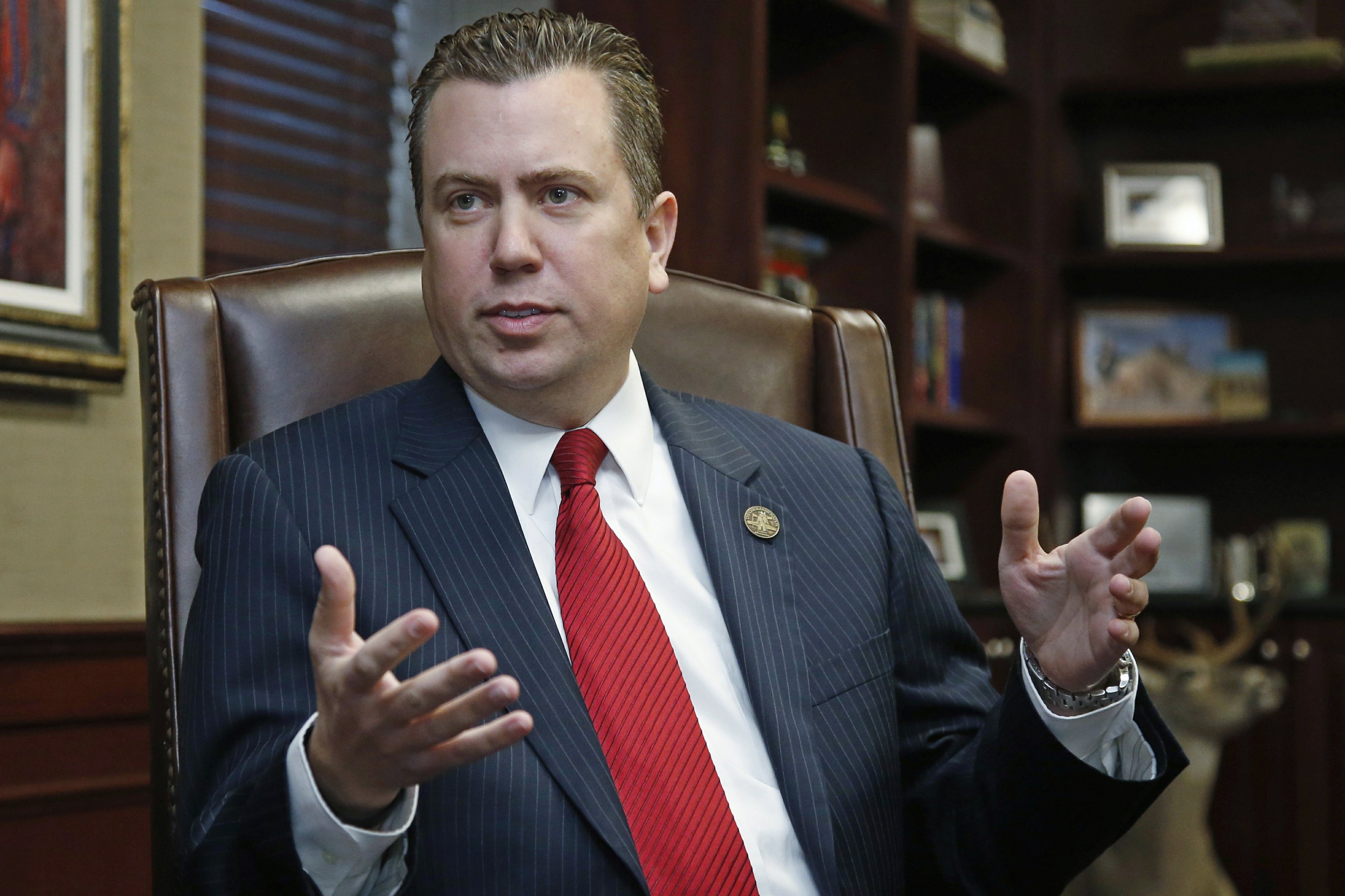 Former Oklahoma congressman resigns from NRA's board AP News