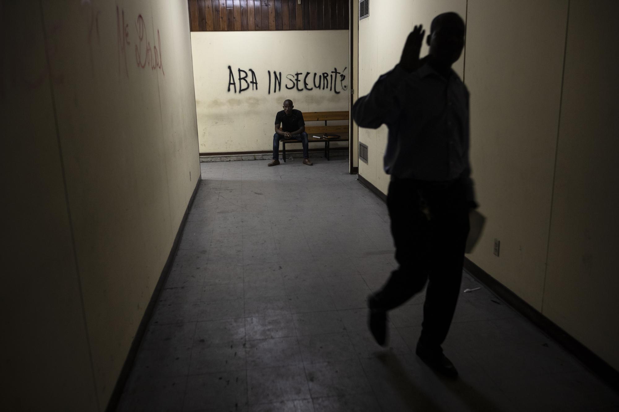 A wall inside the Palace of Justice is spray-painted with a message that reads in Creole; "Down with insecurity", in Port-au-Prince, Haiti, Thursday, Sept. 16, 2021. Even before the assassination of President Jovenel Moise in July, the government was weak -- the Palace of Justice inactive, congress disbanded by Moise and the legislative building pocked by bullets. (AP Photo/Rodrigo Abd)