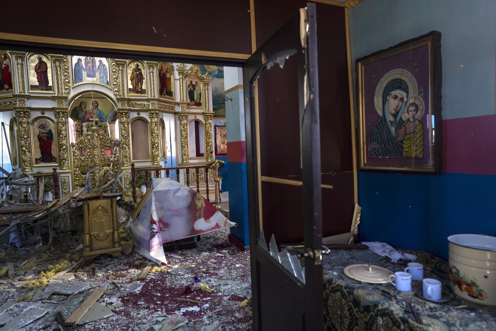 Damage is seen inside a Ukrainian Orthodox Church in Yasnogorodk, a rural town where the Ukrainian army stopped the advance of the Russian army, outskirts of Kyiv, Ukraine, Friday, March 25, 2022. (AP Photo/ (AP Photo/Rodrigo Abd)