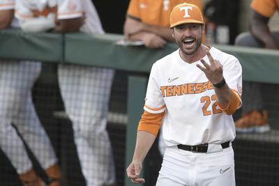 Chest bumps for charity: Vols coach makes best of suspension | AP News