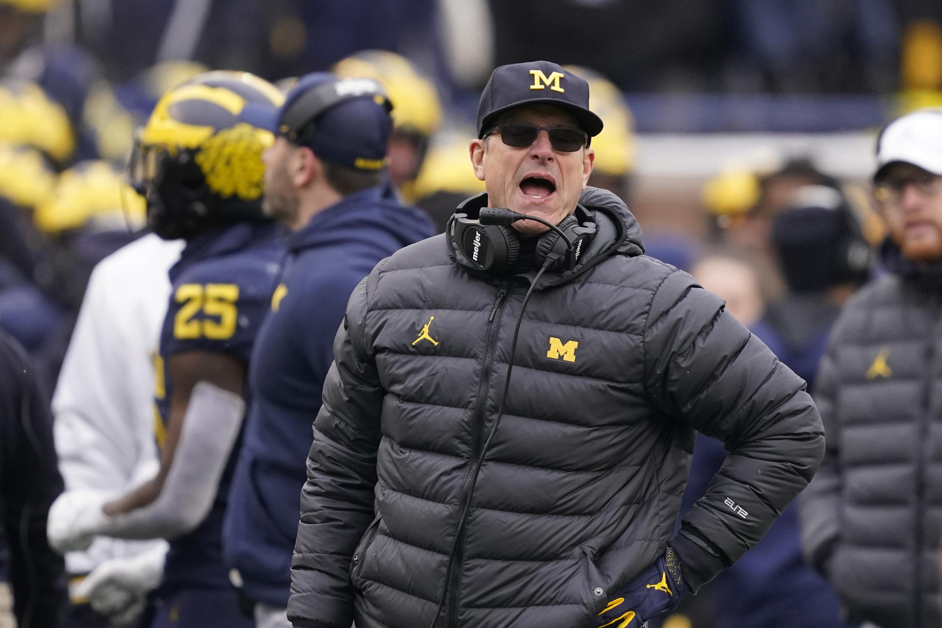 Michigan raises Harbaugh's pay back to over $7m per year | AP News