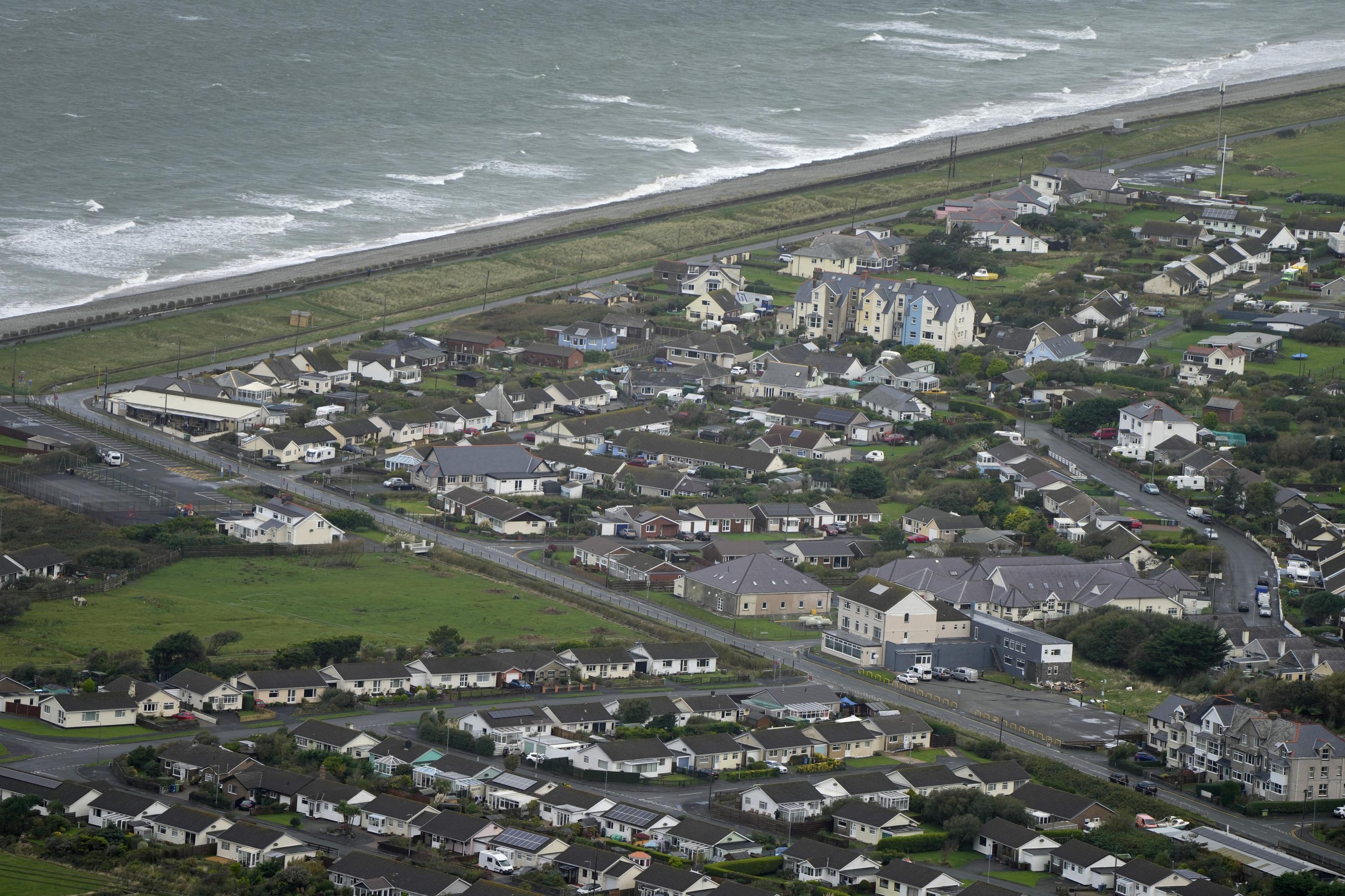 Frustration, defiance in village to be abandoned to the sea