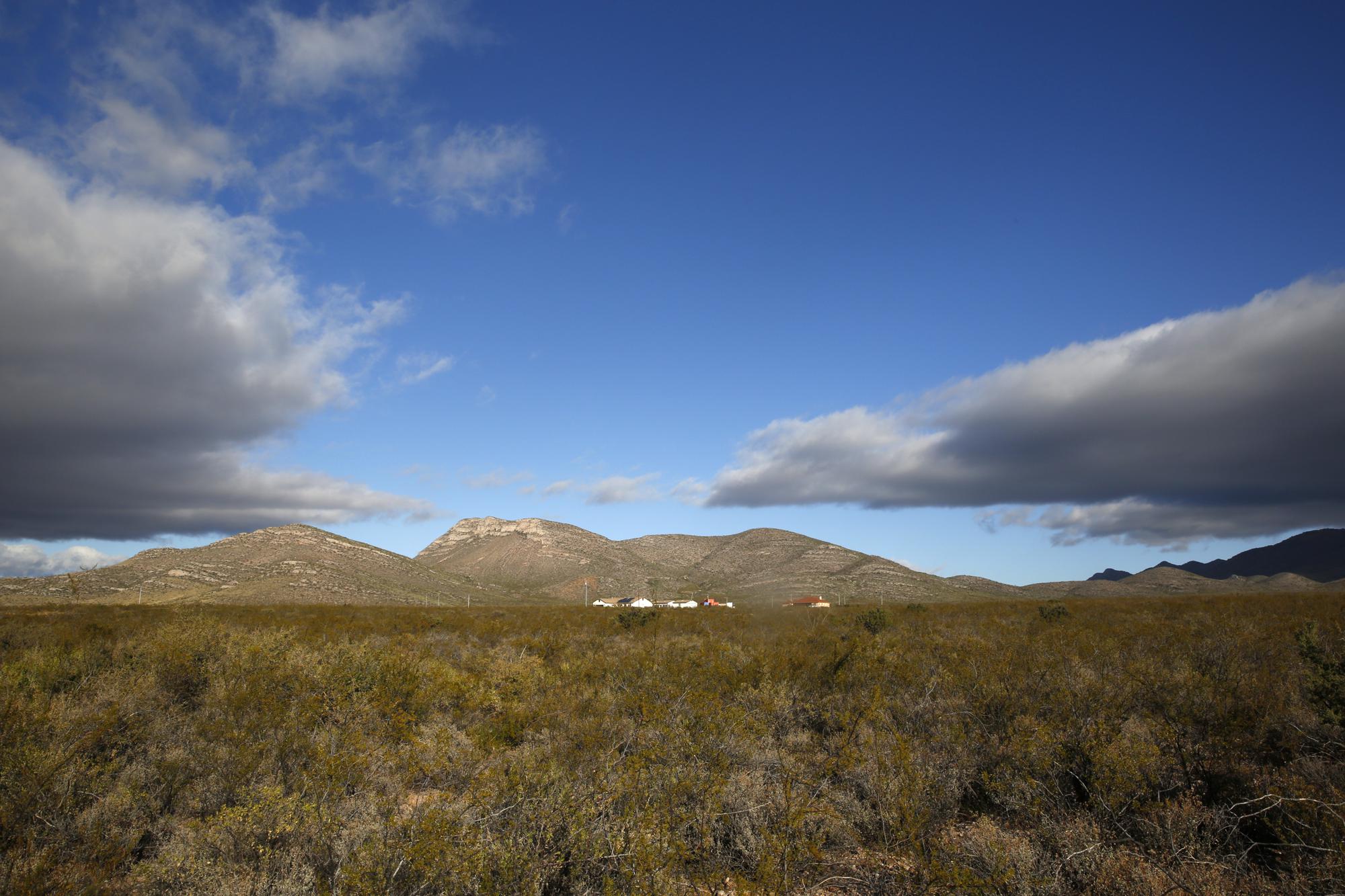 Clouds hang over the area that what was once the home of Paul Adams and his family on the outskirts of Bisbee, Ariz., Oct. 26, 2021. Adams, a Mormon and U.S. Border Patrol agent living with his wife and six children, admitted he had posted videos on the dark web of him molesting two of his children, a 9-year-old girl and a younger daughter he began raping when she was only 6 months old. Adams committed suicide after his arrest. The revelation that Mormon officials directed an effort to conceal years of abuse in the Adams household sparked a criminal investigation of the Church by Cochise County attorney and a civil lawsuit by three of the Adams' children. (AP Photo/Dario Lopez-Mills)