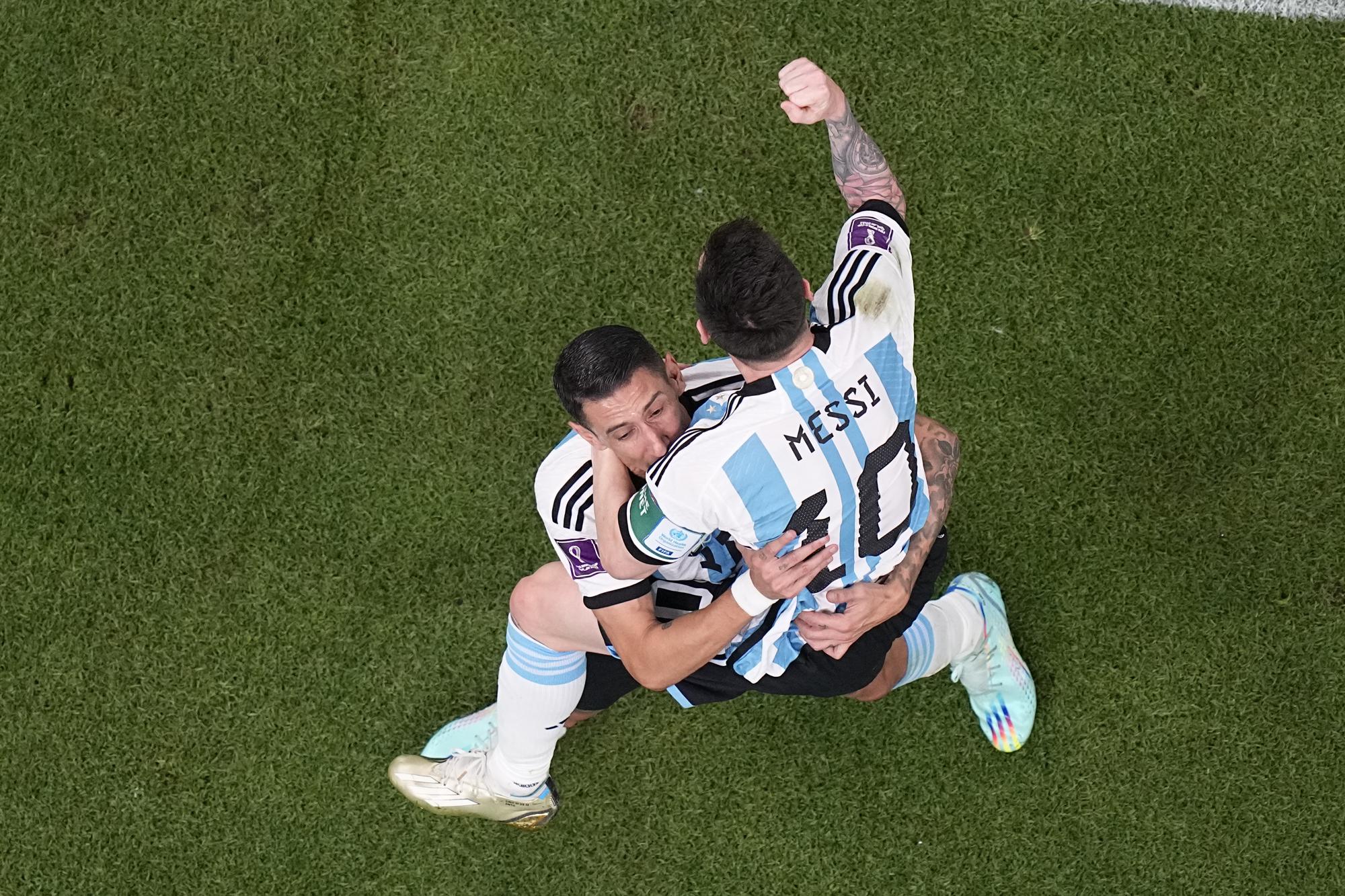 Argentina's Lionel Messi celebrates after scoring his side's opening goal during the World Cup group C soccer match between Argentina and Mexico, at the Lusail Stadium in Lusail, Qatar, Saturday, Nov. 26, 2022. (AP Photo/Pavel Golovkin)