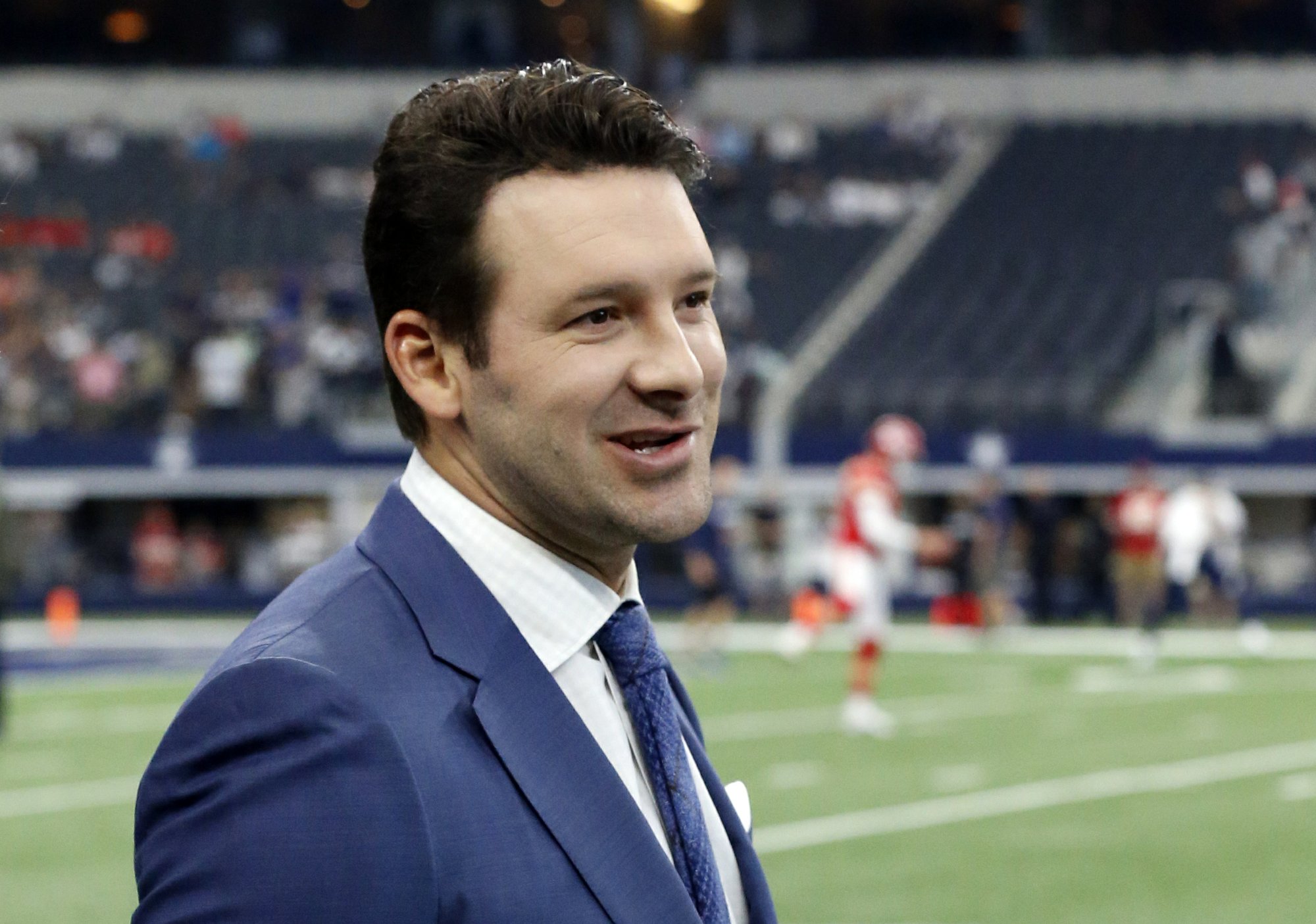 Romo remains with CBS after agreeing to long-term contract | AP News
