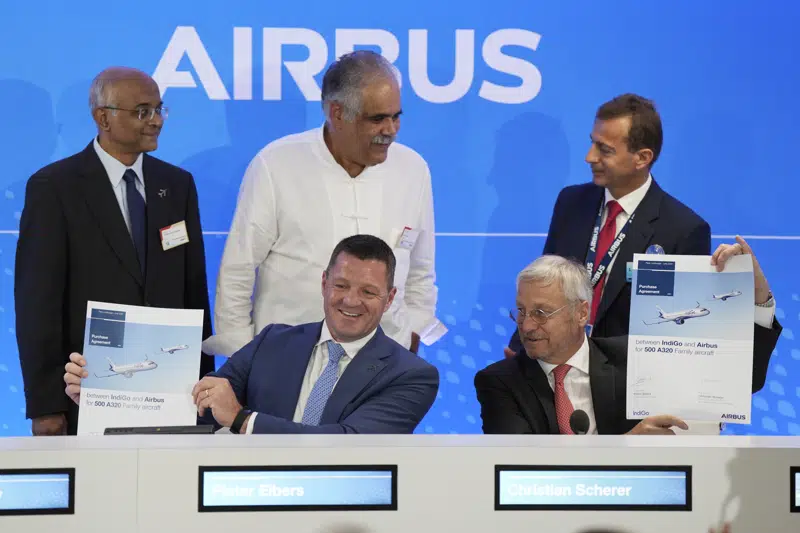 CEO of IndiGo Pieter Elbers, bottom left, Airbus Chief Commercial Officer and Head of International Christian Scherer, borrom right, Chairman and Non-Executive Independent Director of IndiGo Dr. Venkataramani Sumantran, left, Promoter & Managing Director of IndiGo Rahul Bhatia, centre, and Airbus CEO Guillaume Faury pose for a picture with signed documents during a news conference during the Paris Air Show in Le Bourget, north of Paris, France, Monday, June 19, 2023. (AP Photo/Lewis Joly)