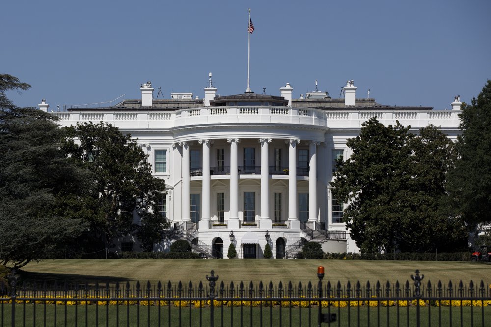 FILE - In this Sept. 25, 2019, file photo, The White House is seen from the Ellipse in Washington. Forty lobbyists with ties to President Donald Trump helped their clients secure over $10 billion in federal coronavirus aid. Among them are five former administration officials whose lobbying work potentially violates an ethics order Trump issued after taking office. (AP Photo/Carolyn Kaster, File)