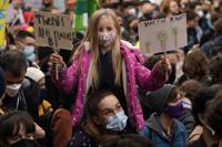 Climate activists march through the streets of Glasgow, Scotland, Friday, Nov. 5, 2021 which is the host city of the COP26 U.N. Climate Summit. The protest was taking place as leaders and activists from around the world were gathering in Scotland's biggest city for the U.N. climate summit, to lay out their vision for addressing the common challenge of global warming. (AP Photo/Alberto Pezzali)