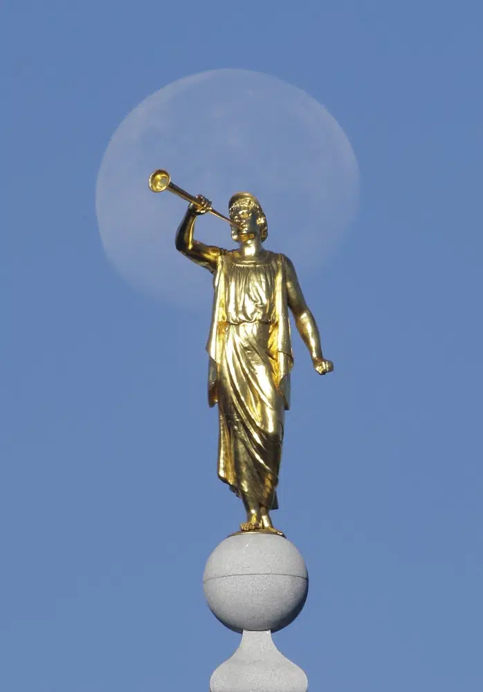 FILE - The angel Moroni statue sits atop the Salt Lake Temple of The Church of Jesus Christ of Latter-day Saints at Temple Square on Sept. 11, 2014, in Salt Lake City. The U.S. Securities and Exchange Commission says, Tuesday, Feb. 21, 2023, The Church of Jesus Christ of Latter-day Saints and its investment arm will pay $5 million in fines. The SEC alleges the church used shell companies to obscure the size of the portfolio under the church's control. (AP Photo/Rick Bowmer, File)