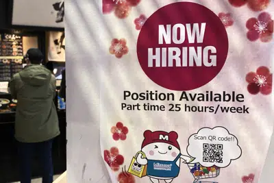 FILE - A hiring sign is displayed at a grocery store in Arlington Heights, Ill., Tuesday, Dec. 27, 2022. On Thursday, the Labor Department reports on the number of people who applied for unemployment benefits last week. (AP Photo/Nam Y. Huh, File)