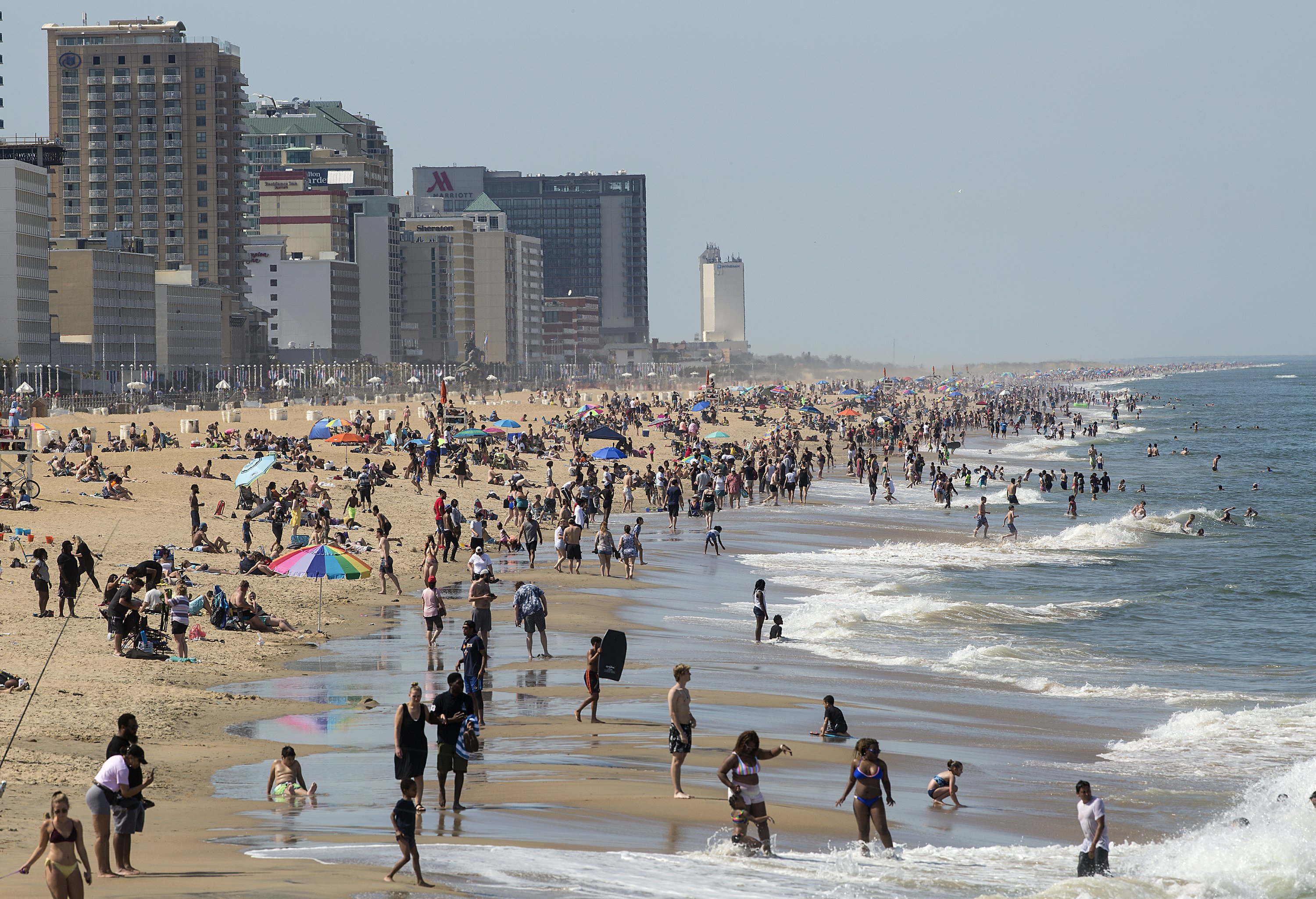 Weather draws crowds to closed Virginia Beach oceanfront AP News