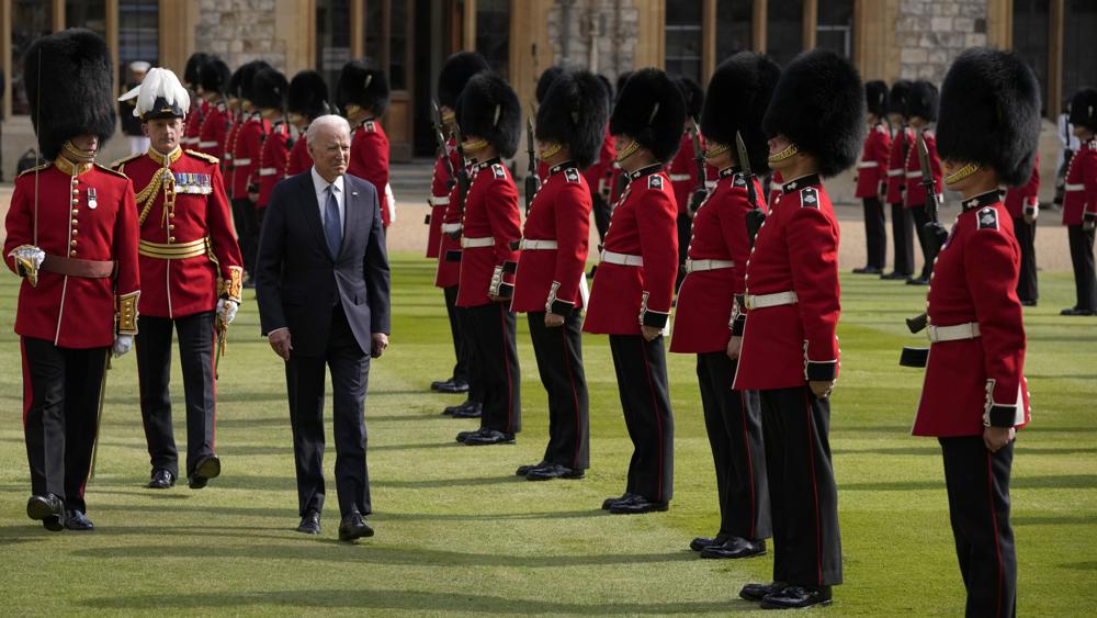 US President Joe Biden inspects a Guard of Honour after arriving to meet Britain's Queen Elizabeth II at Windsor Castle near London, Sunday, June 13, 2021. (AP Photo/Matt Dunham, Pool)