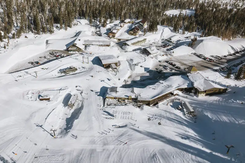 In this aerial drone image provided by Mammoth Mountain, the ski resort is covered with snow in Mammoth Lakes, Calif., on March 16, 2023. The Mammoth Mountain ski resort in the Eastern Sierra said this has been its snowiest season on record, with 695 inches at the main lodge and 870 inches on the summit of the 11,053-foot peak, as of Tuesday, March 28, 2023. (Samantha Deleo/Mammoth Mountain via AP)