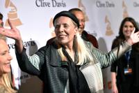 FILE - Joni Mitchell arrives at the 2015 Clive Davis Pre-Grammy Gala in Beverly Hills, Calif. Feb. 7, 2015. Joni Mitchell said Friday, Jan. 28, 2022 she seeks to remove all of her music in Spotify in solidarity with Neil Young, who ignited a protest against the streaming service for airing a podcast that featured a figure who has spread misinformation about the coronavirus. (Photo by John Shearer/Invision/AP, File)