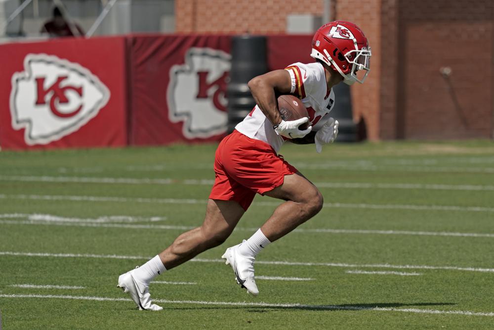 Kansas City Chiefs cornerback Trent McDuffie runs the ball during rookie mini camp NFL football practice Monday, May 9, 2022, in Kansas City, Mo. (AP Photo/Charlie Riedel)