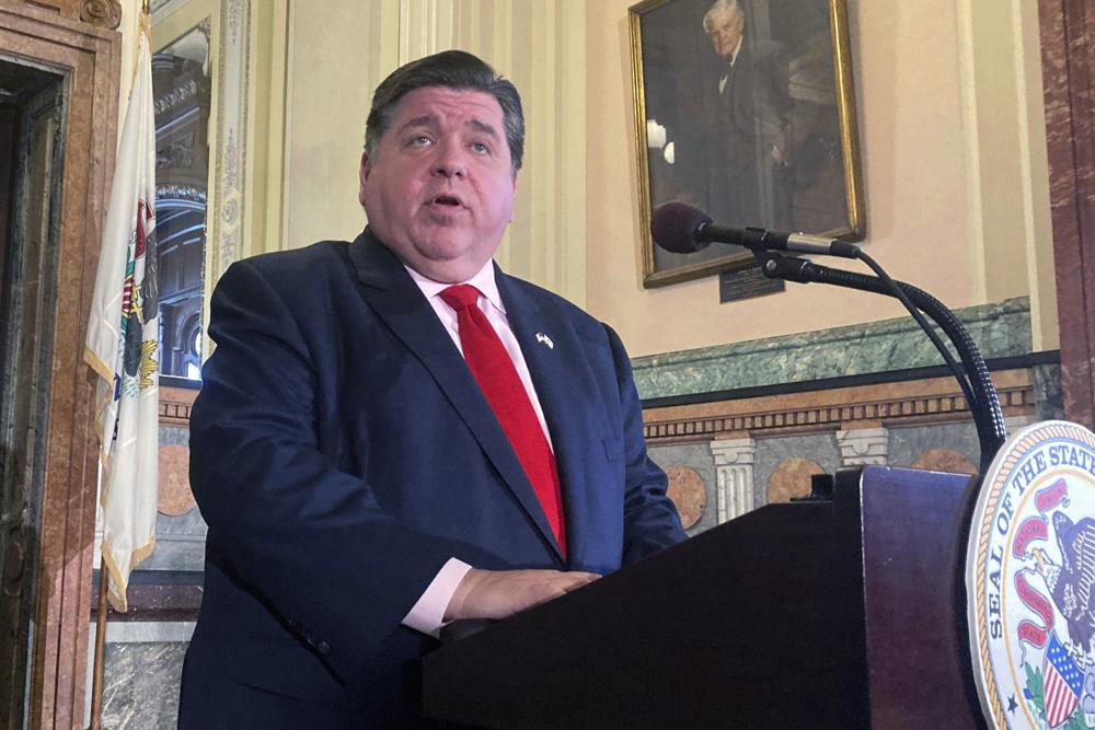 FILE -In this April 7, 2022, file photo. Illinois Gov. J.B. Pritzker addresses reporters in Springfield, Ill., about a budget deal reached among Democrats. The Illinois Fuel & Retail Association on Thursday, May 19, 2022 filed a lawsuit against the Illinois Department of Revenue over signage required on gas pumps in July explaining that the state has not increased the motor fuel tax and the savings should be reflected on he pump. Fuel retailers say it violates their right to free speech and requires them to post political speech. (AP Photo/John O'Connor, File
