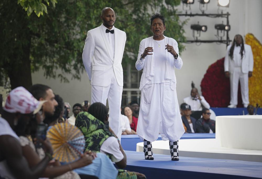 Elaine Brown, center, former leader of the Black Panthers, open the Pyer Moss fashion show with a Black history speech, Saturday, July 10, 2021, in Irvington, N.Y., at the Villa Lewaro mansion, the home built by African American entrepreneur Madam C.J. Walker in 1917. (AP Photo/Bebeto Matthews)