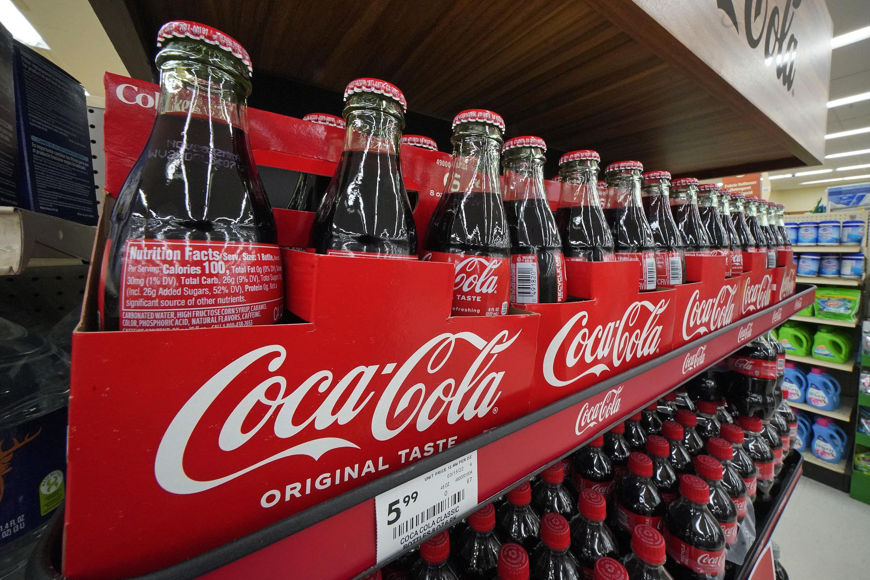 Coke sees slower growth ahead as price hikes moderate | AP News