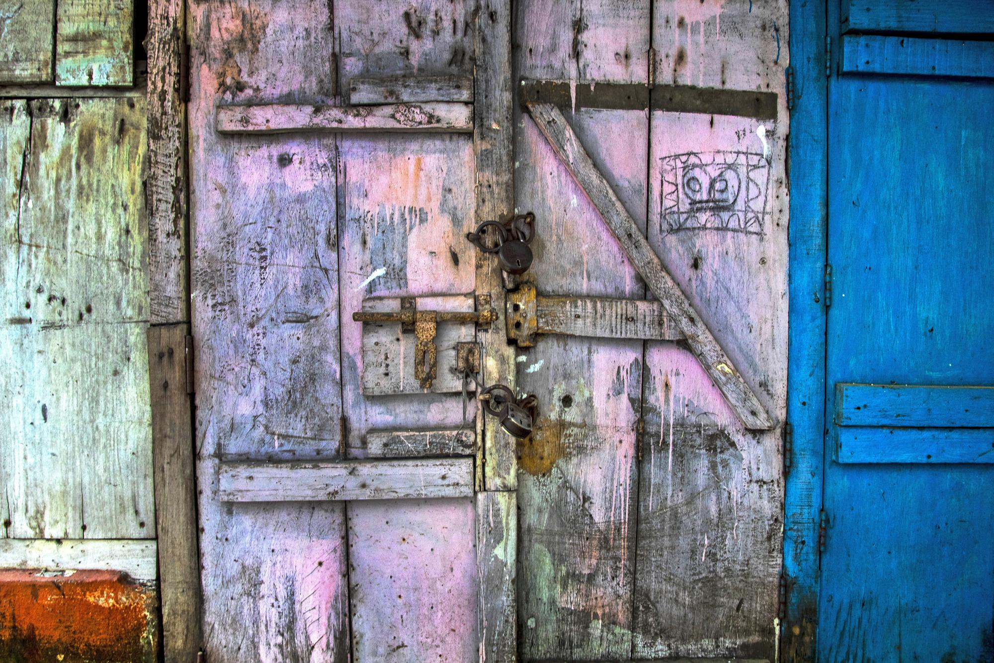 A shop is seen locked at a market area in Gauhati, India on June 18, 2021. Rows of locked shops confront bargain-hunters for most of the day in Fancy Bazar, a nearly 200-year-old market that offered cheap prices until the COVID-19 pandemic hit Gauhati, the biggest city in India’s remote northeast. (AP Photo/Anupam Nath)
