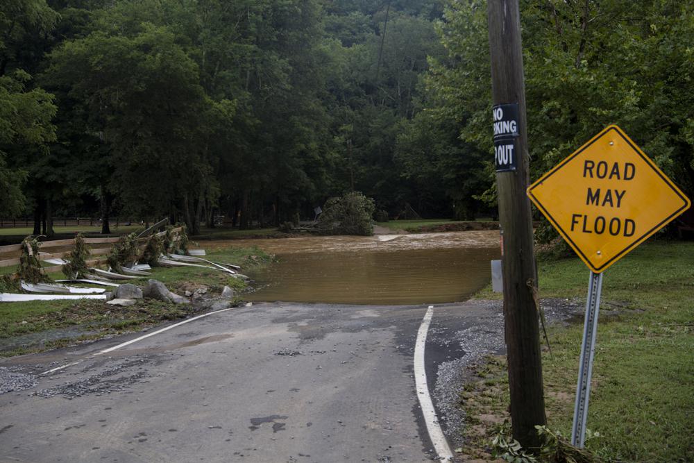 Water covers Sam Hollow Road following heavy rainfall on Saturday, Aug. 21, 2021, in Dickson, Tenn. (Josie Norris/The Tennessean via AP)