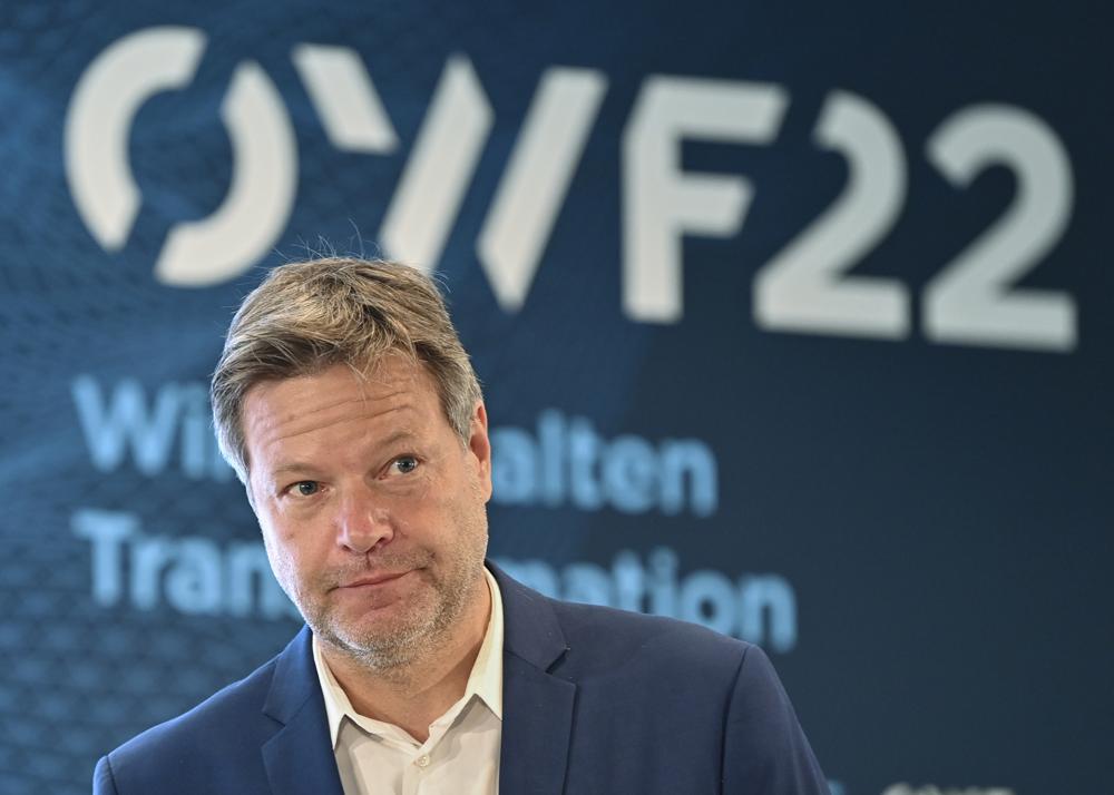 FILE - Robert Habeck, Federal Minister for Economic Affairs and Climate Protection, takes part in the East German Economic Forum (OWF) in Bad Saarow, Germany, Monday, June 13, 2022. Habeck is stepping up an appeal for the country's residents to save energy after Russia's Gazprom announced significant cuts in natural gas deliveries through a key pipeline. (Patrick Pleul/dpa via AP, File)