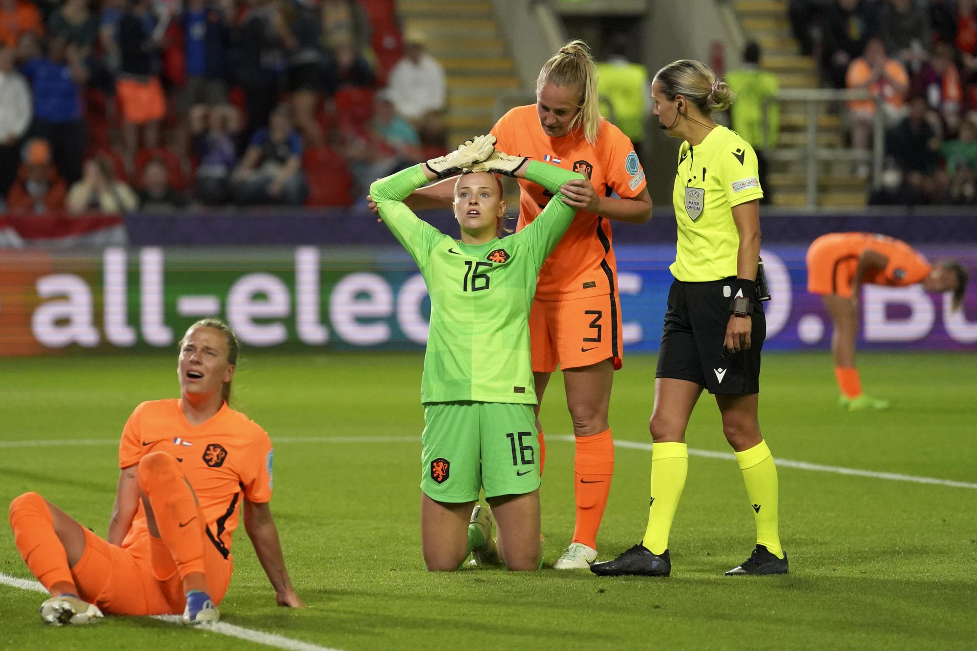 FILE - Netherlands' goalkeeper Daphne van Domselaar, center, and her teammates react after France's Grace Geyoro failed to score during the Women Euro 2022 quarterfinals soccer match between France and the Netherlands at the New York Stadium in Rotherham, England, Saturday, July 23, 2022. (AP Photo/Jon Super, File)