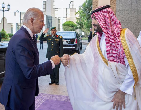 In this image released by the Saudi Royal Palace, Saudi Crown Prince Mohammed bin Salman, right, greets President Joe Biden with a fist bump after his arrival at Al-Salam palace in Jeddah, Saudi Arabia, Friday, July 15, 2022. (Bandar Aljaloud/Saudi Royal Palace via AP)