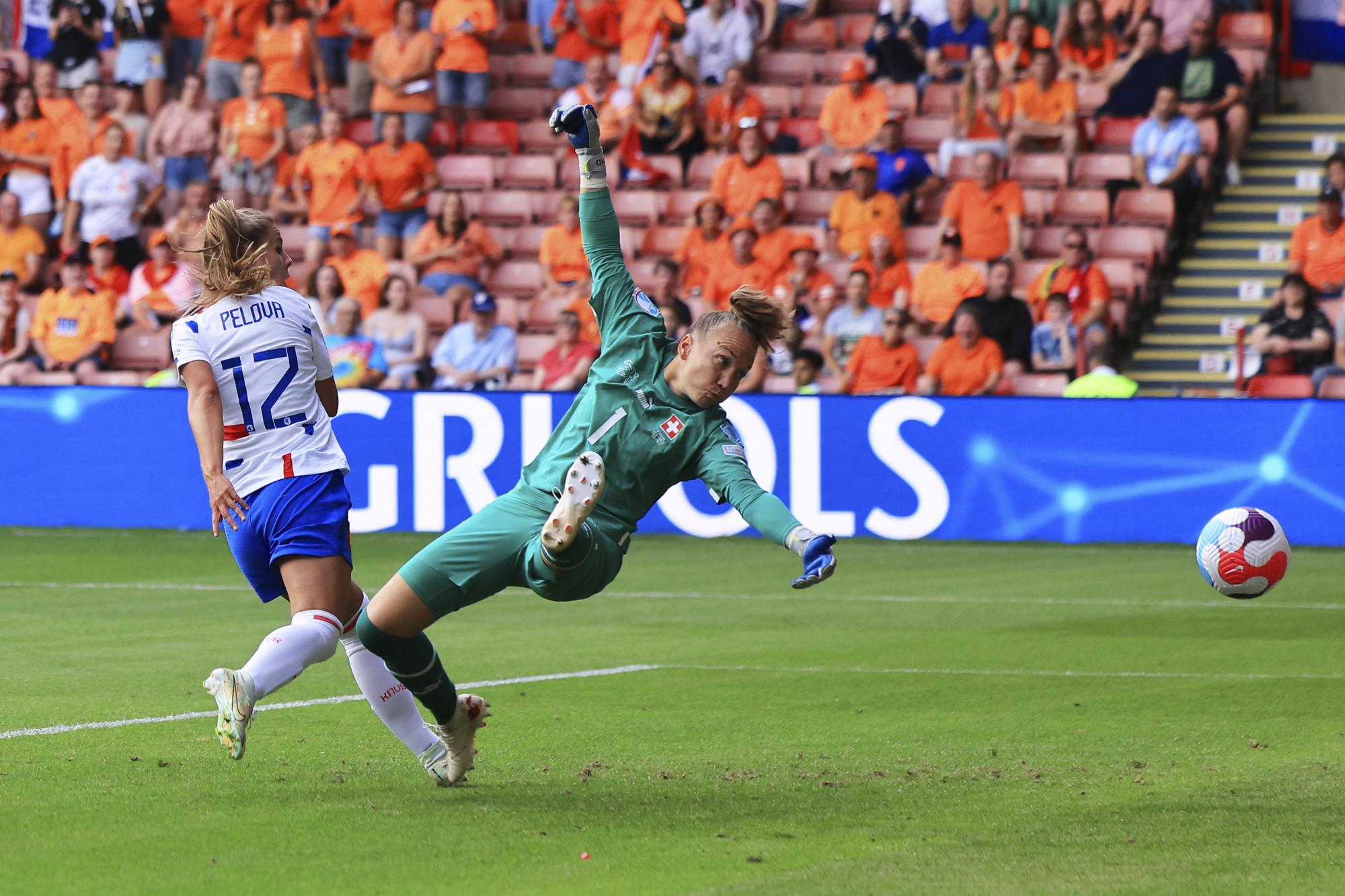 FILE - Netherlands' Victoria Pelova, left, scores her side's fourth goal as Switzerland's goalkeeper Gaelle Thalmann tries to stop the ball during the Women Euro 2022 soccer match between Switzerland and Netherlands at Bramall Lane Stadium in Sheffield, England, Sunday, July 17, 2022. (AP Photo/Leila Coker, File)