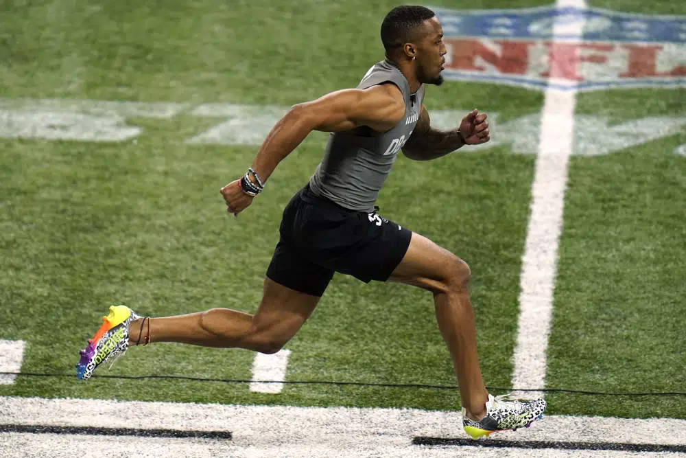 Michigan defensive back DJ Turner II runs the 40-yard dash at the NFL football scouting combine, Friday, March 3, 2023, in Indianapolis. (AP Photo Erin Hooley)