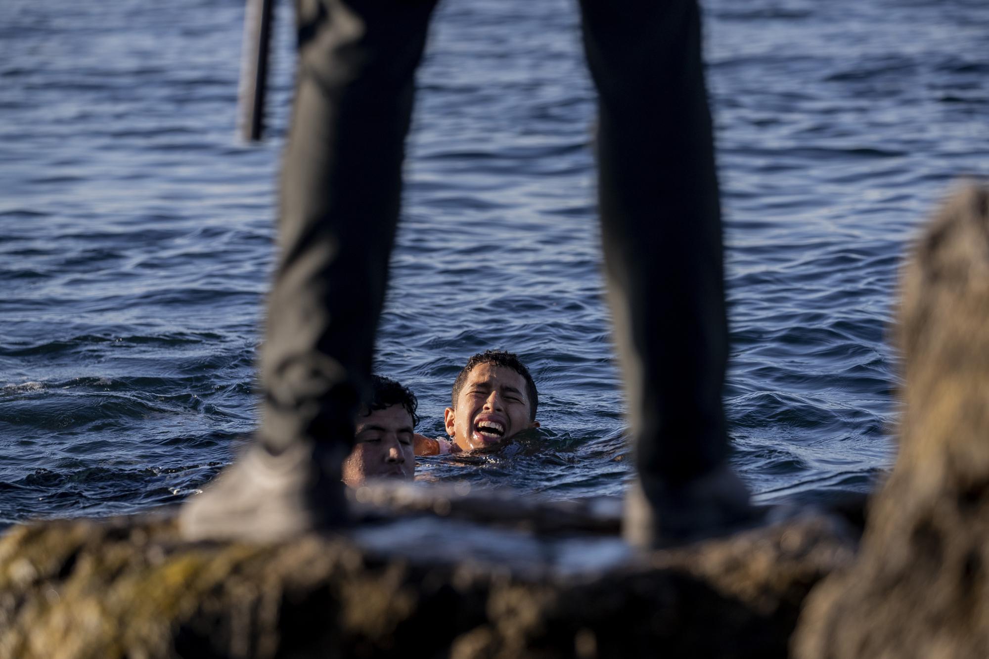 A guardsman waits for migrants to arrive at the Spanish enclave of Ceuta, near the border of Morocco and Spain, Wednesday, May 19, 2021. (AP Photo/Bernat Armangue)