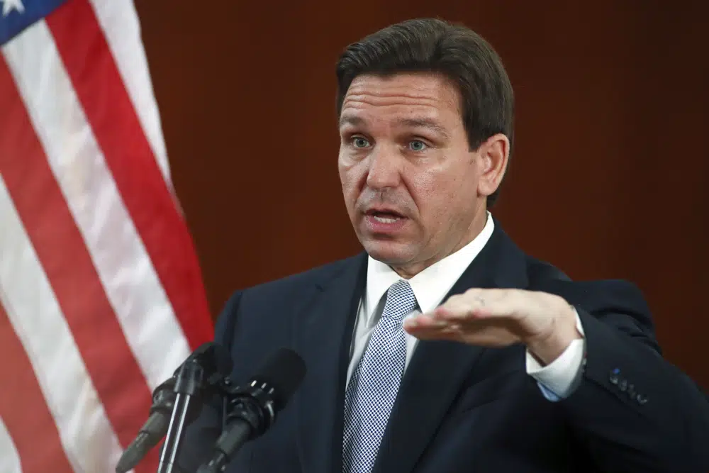 Florida Gov. Ron DeSantis answers questions from the media in the Florida Cabinet following his State of the State address during a joint session of the Senate and House of Representatives Tuesday, March 7, 2023, at the Capitol in Tallahassee, Fla. (AP Photo/Phil Sears)