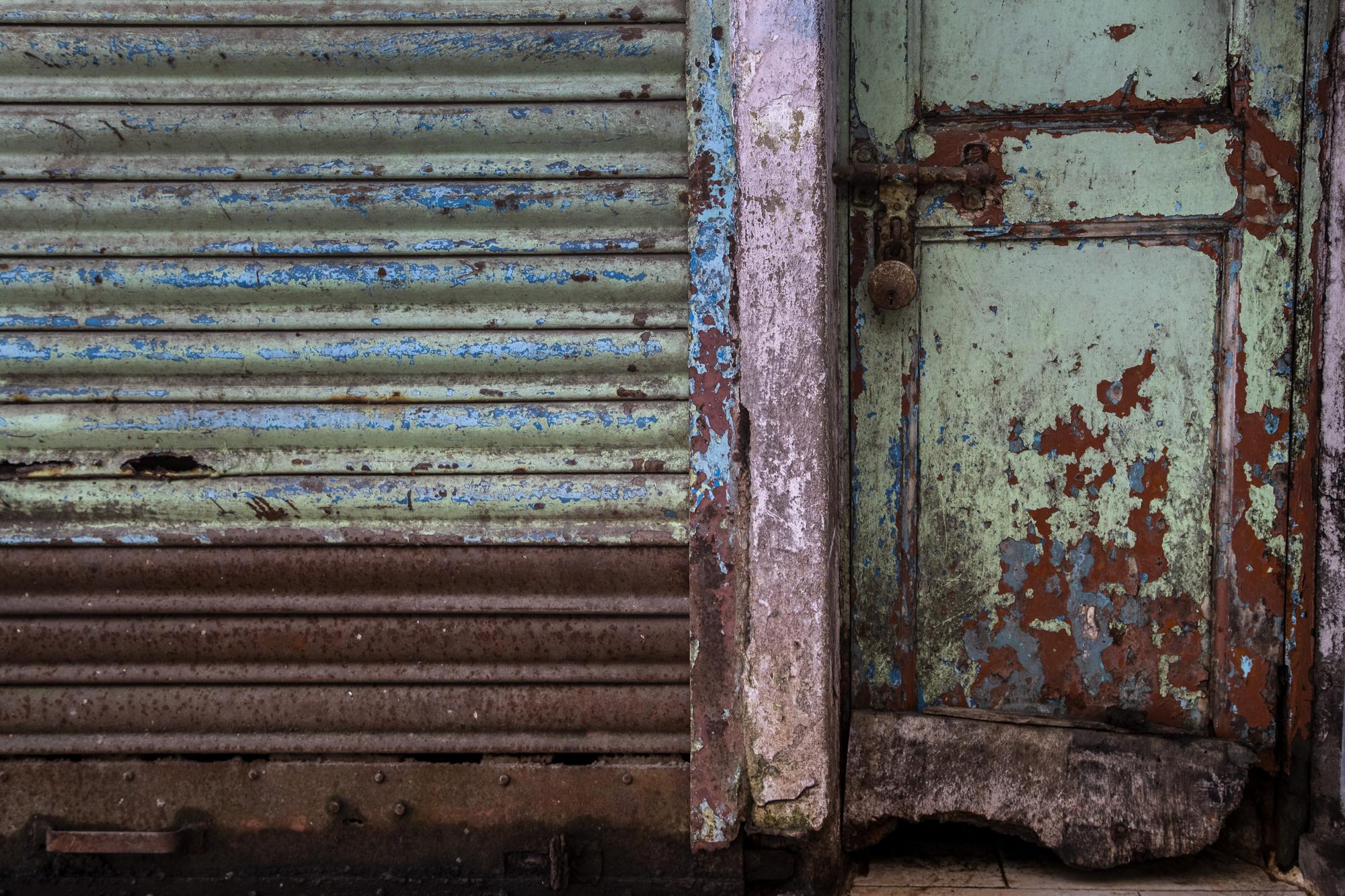 A shop is seen locked at a market area in Gauhati, India, on June 18, 2021. Rows of locked shops confront bargain-hunters for most of the day in Fancy Bazar, a nearly 200-year-old market that offered cheap prices until the COVID-19 pandemic hit Gauhati, the biggest city in India’s remote northeast. (AP Photo/Anupam Nath)