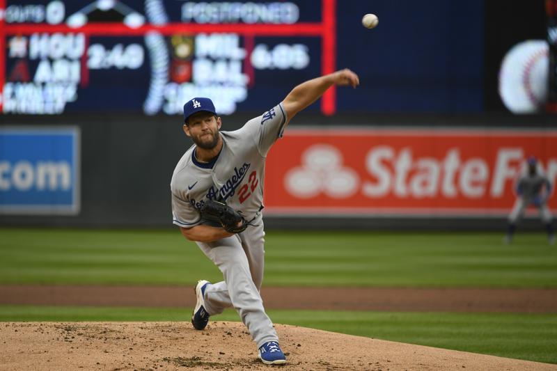 Los Angeles Dodgers pitcher Clayton Kershaw throws against the Minnesota Twins during the first inning of a baseball game, Wednesday, April 13, 2022, in Minneapolis. (AP Photo/Craig Lassig)