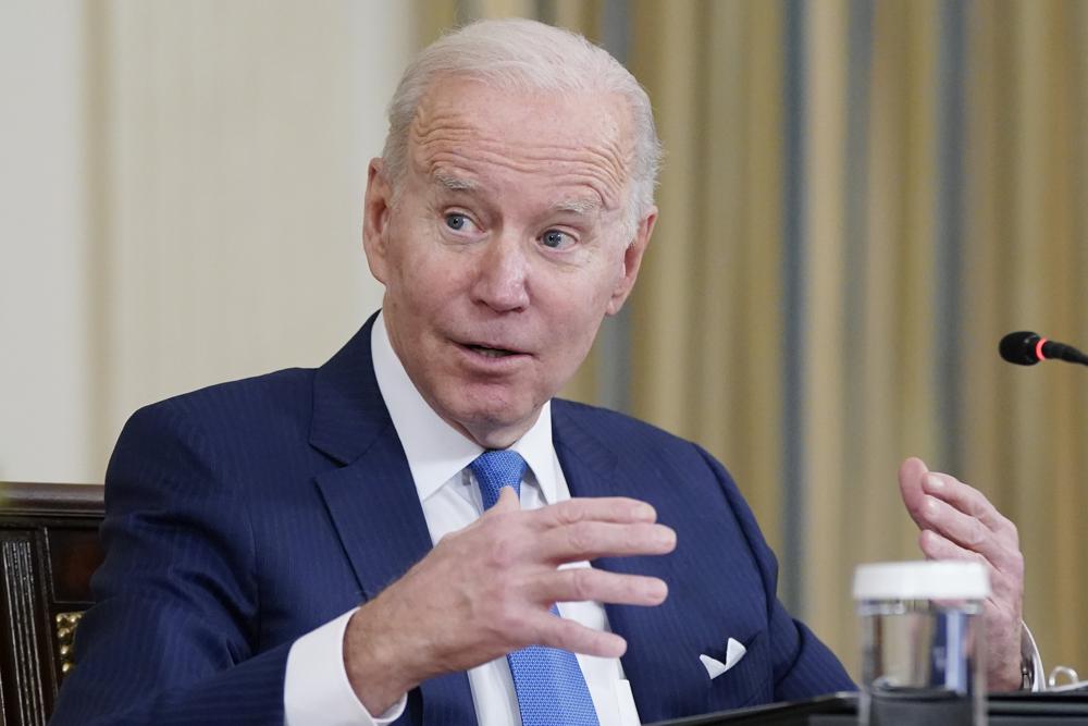 Under pressure to ease up, Biden weighs new virus response