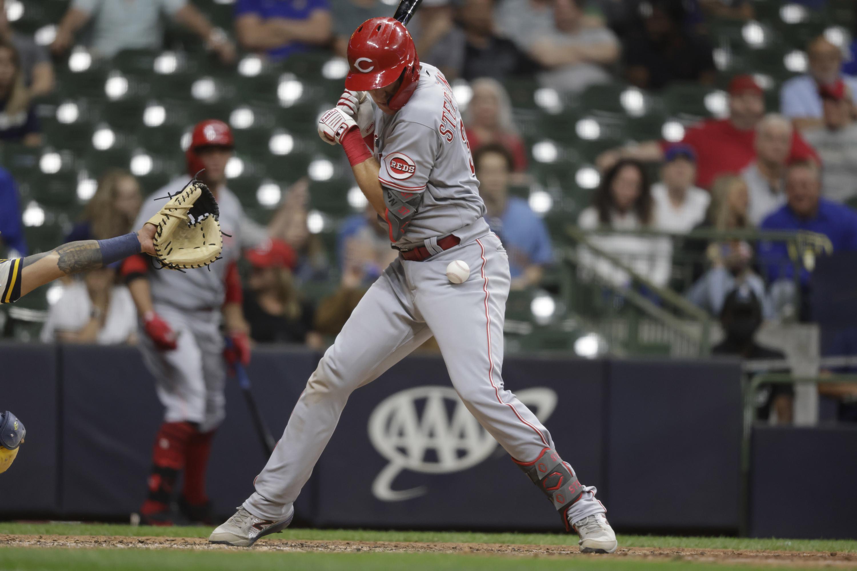 Reds score 2 in 10th without hit, beat Brewers 21 AP News