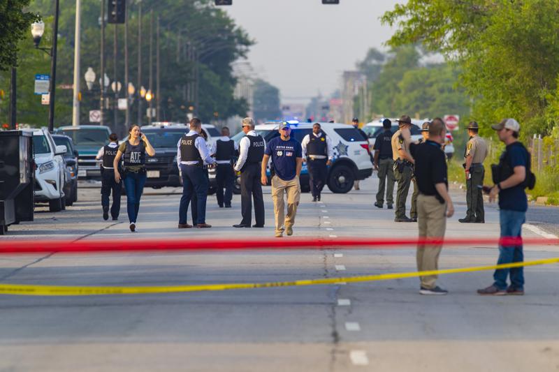 Chicago police and ATF agents work the scene of a shooting on South Ashland Avenue near West 118th Street next to Interstate 57,  Wednesday, July 7, 2021.  Police say three undercover law enforcement officers were shot and wounded while driving onto an expressway on Chicago’s South Side. (Vashon Jordan Jr./Chicago Tribune via AP)