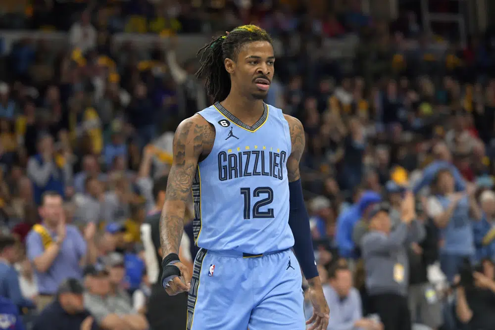 FILE - Memphis Grizzlies guard Ja Morant (12) plays during the second half of Game 5 in a first-round NBA basketball playoff series against the Los Angeles Lakers, Wednesday, April 26, 2023, in Memphis, Tenn. Morant has been suspended for the first 25 games of the upcoming season for his second known incident of displaying what appeared to be a firearm on social media, the NBA announced Friday, June 16, 2023. (AP Photo/Brandon Dill, File)