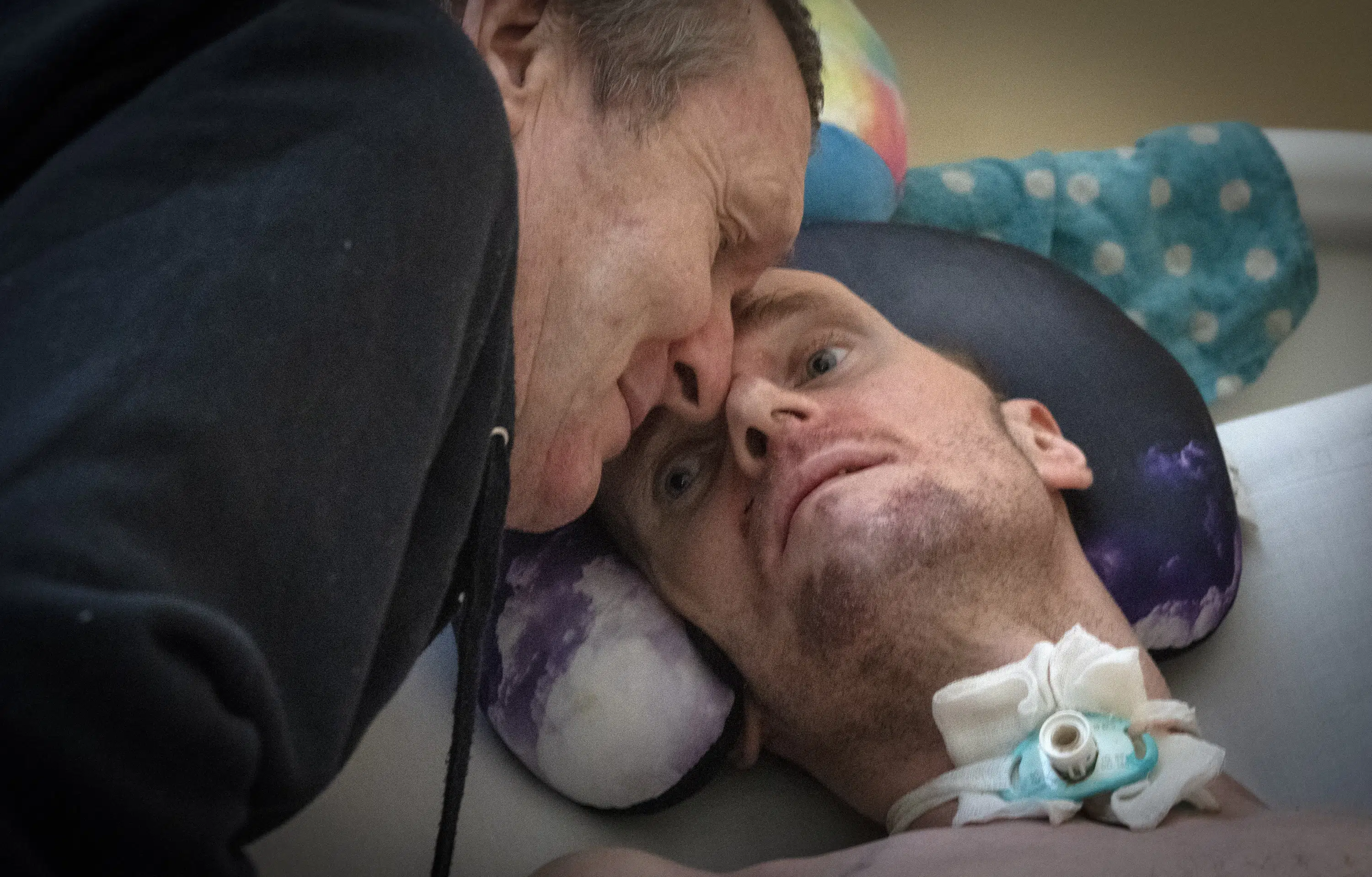 A loving dad and his injured son pay war’s costs in Ukraine