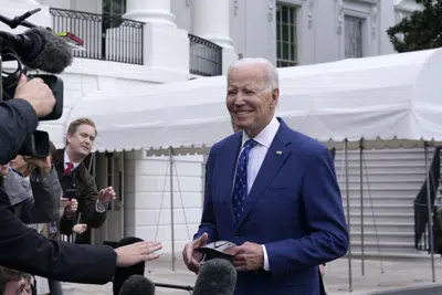 President Joe Biden talks with reporters outside of the White House in Washington, Wednesday, Jan. 4, 2023, before boarding Marine One on the South Lawn. Biden is heading to Kentucky to visit a notoriously dilapidated bridge connecting Ohio and Kentucky to promote his administration's infrastructure law. (AP Photo/Susan Walsh)