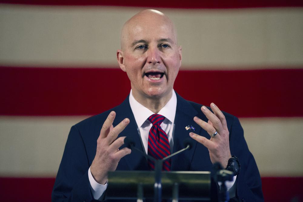 FILE - In this Feb. 26, 2021, file photo, Nebraska Governor Pete Ricketts speaks during a news conference at the Nebraska State Capitol in Lincoln, Neb. Ricketts is ramping up his crusade for the meat industry Wednesday, April 5, 2021, by endorsing a new "beef passport" program to promote meat eating, a few weeks after he blasted Colorado's governor for a resolution encouraging its residents to eat less. (Kenneth Ferriera/Lincoln Journal Star via AP, File)