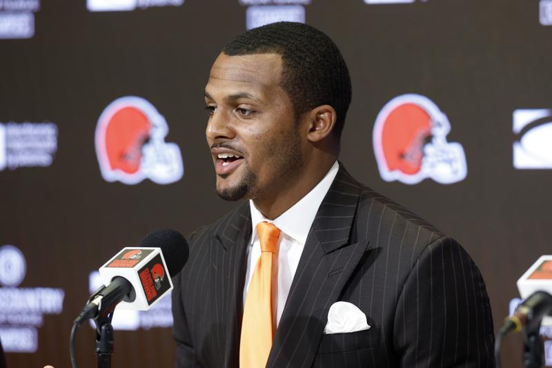 FILE - Cleveland Browns new quarterback Deshaun Watson speaks during a news conference at the NFL football team's training facility, Friday, March 25, 2022, in Berea, Ohio. Deshaun Watson's going to huddle up the Browns on the beach. Cleveland's new quarterback is treating some of his new offensive teammates to a weekend in the Bahamas to do some bonding and field work. (AP Photo/Ron Schwane, File)