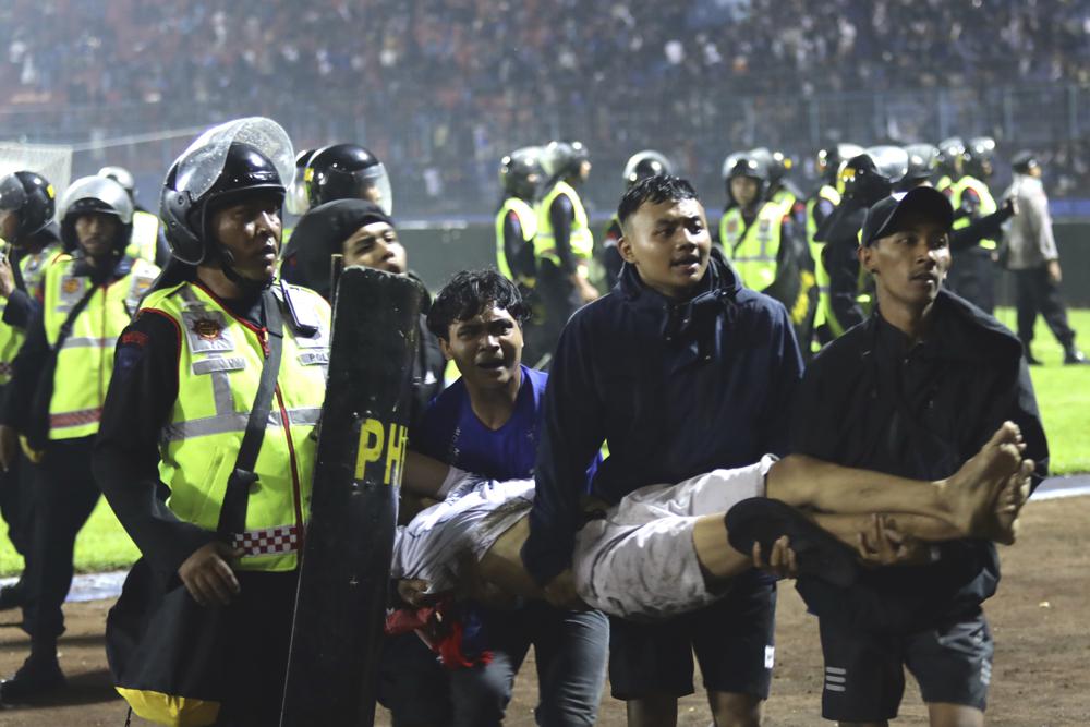174 die as tear gas triggers crush at Indonesia soccer match