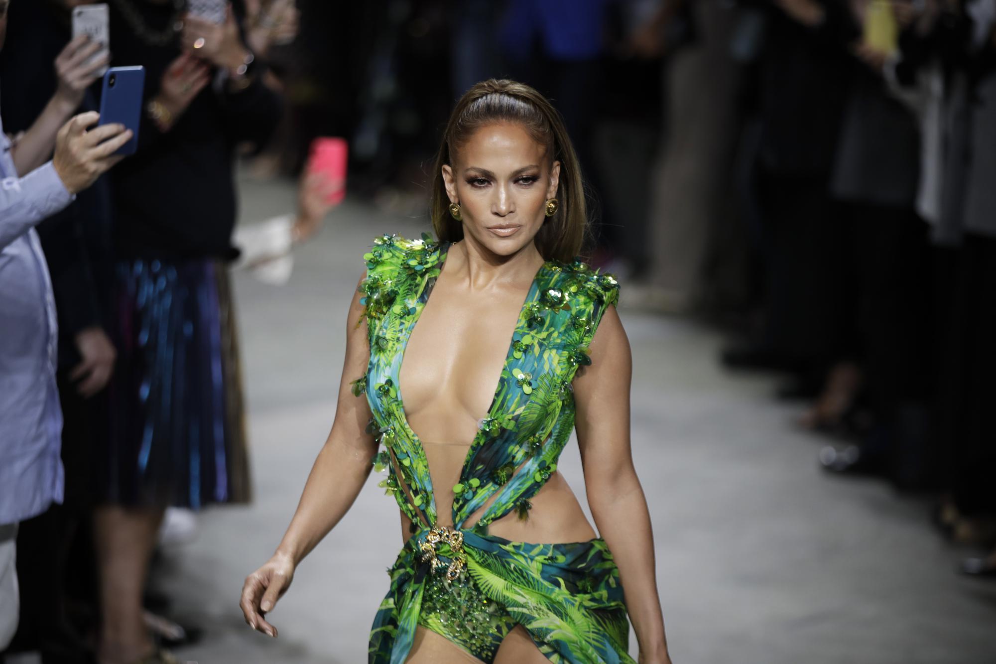 Milan Fashion: J-Lo struts updated jungle dress at Versace | AP News