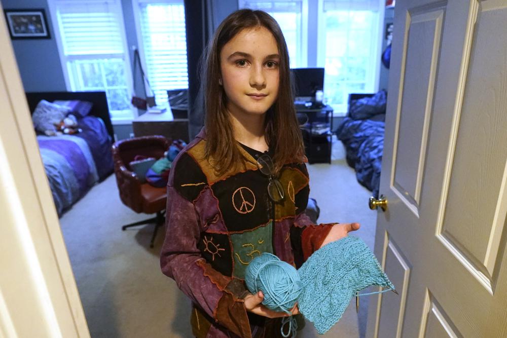 Elle Palmer, 13, poses for a photograph, Monday, Feb. 7, 2023, in Salt Lake City. Elle came out as a transgender girl in fifth grade. Now in seventh, she planned to start hormone treatment this summer so potential side effects wouldn’t interfere with her life during the school year, especially her team's extracurricular math competitions. (AP Photo/Rick Bowmer)