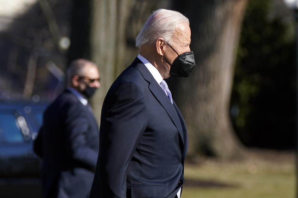 President Joe Biden walks to board Marine One on the South Lawn of the White House, Friday, Feb. 11, 2022, in Washington to travel to Camp David, Md. (AP Photo/Manuel Balce Ceneta)