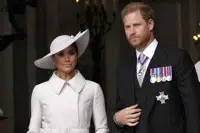 FILE - Prince Harry and Meghan Markle, Duke and Duchess of Sussex leave after a service of thanksgiving for the reign of Queen Elizabeth II at St Paul's Cathedral in London, Friday, June 3, 2022 on the second of four days of celebrations to mark the Platinum Jubilee. Prince Harry and his wife Meghan announced Wednesday, March 8, 2023 that their daughter had been christened in a private ceremony in California, publicly calling her a princess and revealing for the first time that they will use royal titles for their children. (AP Photo/Matt Dunham, Pool, File)