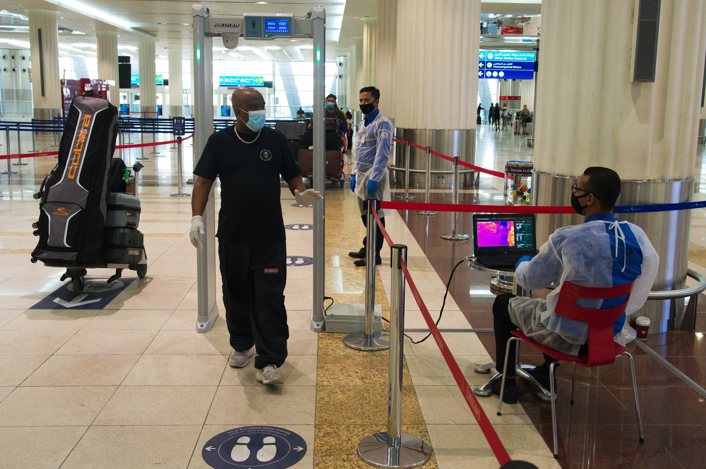 Virus slows Dubai airport, world's busiest travel | AP