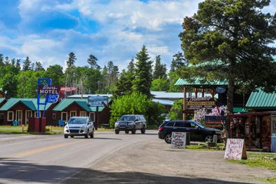 This 2019 photo shows a street in the village of East Glacier Park, Mont. Authorities said a man drove his pickup into a family as they walked through the tourist village on Sunday, July 17, 2022, then shot and killed an 18-month-old girl and her father before the toddler's aunt killed the assailant. (Rion Sanders/The Great Falls Tribune via AP)